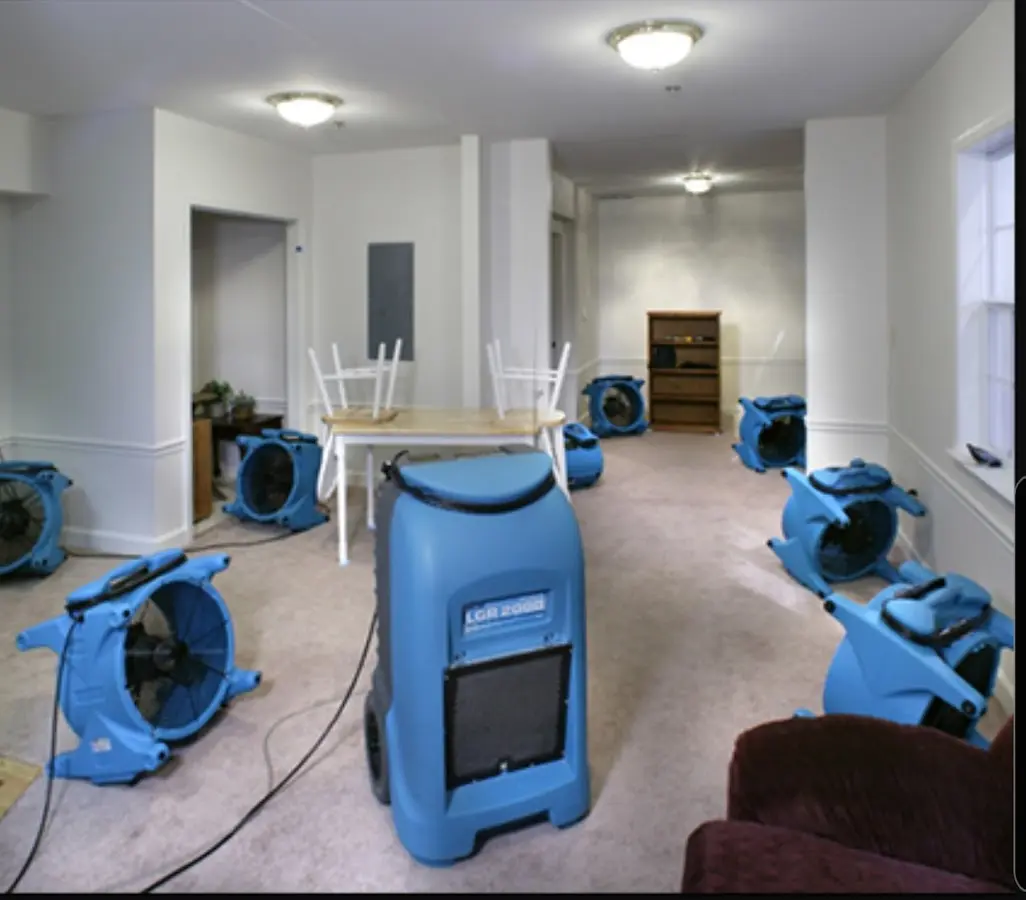 Air movers and dehumidifier setup for Water Damage Restoration in Commerce